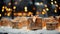 Many gift boxes on a snowy surface with blurred lights