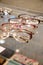 Many glasses rows at optical retail store. Rich assortment choice of different eyewear frames on eyeglasses shop display