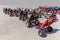 Many go-karts parked on asphalt terrain