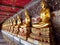 Many Gold-colored Buddha statue in Buddhist temple