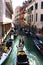Many gondolas on narrow Venice canal