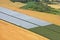 Many greenhouses on the fields of France, the top view