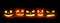Many Halloween Pumpkin glowing faces in a row. 3D Rendering illustration