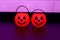 Many halloween pumpkins with scary faces looking forward