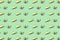 Many halves of avocado, pattern, banner. Preparation of a bright background, green mint pastel color