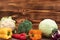 Many healthy different vegetarian organic vegetables on a wooden background