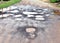 Many hole on asphalt road in countryside in rainy season