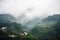 Many home in the valley near Yangtze river in rainy day, haze float over mountain