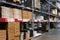 Many items inside cardboard boxes on warehouse storage shelves