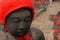 Many jizo with red hat