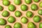 Many juicy green apples on color background