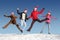 Many jumping people on snow