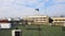 Many kind of air compressors installed on rooftop of terrace with height building, telecommunication tower, blue sky and clouds