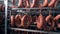 Many kinds of sausages are located in a meat storage room