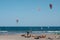 Many kite board surfer and wind surfer on ocean El Medano beach