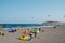 Many kitesurfer and windsurfer on ocean at surfer beach El Medan