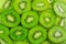 Many kiwi fruit slices background