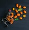 Many kumquats shopping cart basket scatter  dark orange top view