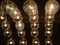 Many light bulbs on the black scene. Lighting decor, vintage lamp