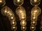 Many light bulbs on the black scene. Lighting decor, vintage lamp