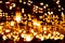 many lighted candles lit with mirrors reflecting the light throughout the space