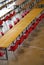 many long table with red chairs