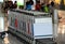Many luggage cart for service tourist or customer use to carry baggage with people sitting background at Hong Kong airport