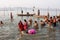 Many men and women bathe in holy river