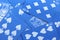 Many miscellaneous jumbled blue playing cards surface.