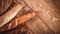 Many mixed baked breads and rolls on rustic wooden table