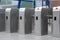 Many modern turnstiles outdoors. Fare collection system