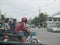 Many motorbike riders waiting and about to take off at a U-turn