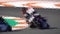 Many motorbikes competing in a racing circuit and slow-mo