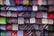 Many multi-colored with patterns of ties lying in a row