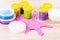 Many multi-colored slimes in jars on the table. Play toy slime