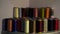 many multi-colored threads lying on the table