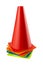 Many multi-colored traffic cones stand in a pile, on a white background, they regulate movements