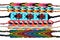Many multi-colored woven friendship bracelets handmade of embroidery bright thread with knots isolated on white background