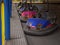 Many multicolored retro bumper cars waiting for people in a luna park