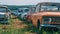 Many old abandoned and forgotten rusty vintage retro car in bad condition, panoramic view