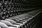 Many old champagne bottles, stacked in the wine cellar close up