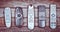 Many old TV remotes on a wooden background. Top view