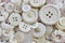 Many old white sewing buttons