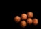 Many orange basketball balls on black background
