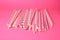 Many paper drinking straws on pink background