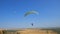 Many paragliders are flying. Silhouette people Paragliding. Paraglide flight experience skydive summer.