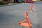 Many parking barriers with No Stopping signs on asphalt in city. Space for text