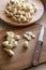 many peeled garlic cloves on wooden cutting boards