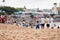 Many people are on the beach of Rio Vermelho, offering gifts for the Yemanja party