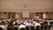 Many people came together at a conference or seminar. Blurred background